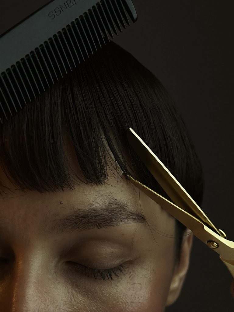 Gold shears trimming a soft fringe